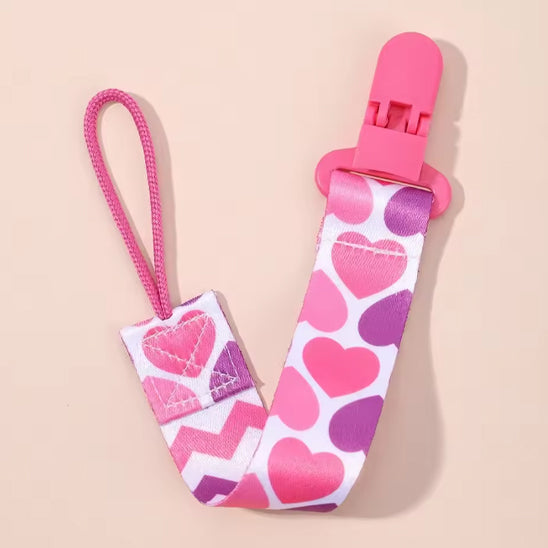 attache tétine rose