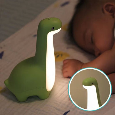 Bébé endormie veilleuse dinosaure vert