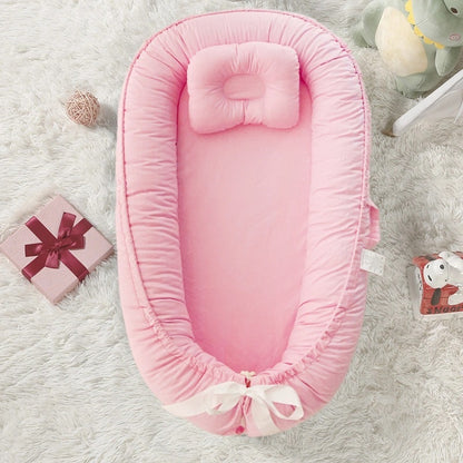 reducteur de lit bebe SlaapNestje™ rose