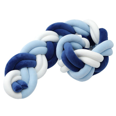 Tresse de lit bebe aux teintes bleu marine, turquoise et blanc offrant une protection douce et élégante